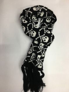 Scare away the cold with this Punk Skull Scarf! Take on the chill with fearless style. This Punk Skull Scarf will keep you warm and add a daring edge to any outfit! Scarf Size: Length: 180cm including Tassels, Width: 15cm Description: Scarf Type: Scarf, ShawlScarf Length: >175cmProcess: KnittedPattern Type: GeometricOrigin: CNMaterial: AcrylicItem Type: Scarves Crochet Scarf Skull, Goth Scarf, Yana Core, Grunge Scarf, Y2k Scarf, Scarf Aesthetic, Oc Design, Punk Skull, Scarf And Hat