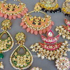 5 pair of assorted golden-toned Traditional Handmade Meenakari Earring for Women with hanging pearls.
 
 Size & Other Details
 Material  : Alloy, Pearl, Meena work
 Attire :  Lehenga Choli, Salwar Suit, Kurti, Saree, Flared Dress
 Pieces : 5pc
 
 Assorted design will come depending on the stock available. Kundan Meenakari Hoop Earrings As A Gift, Festive Meenakari Hoop Earrings For Festivals, Gold Temple Jewelry Chandbalis With Motifs, Bollywood Style Meenakari Hoop Earrings As Gift, Diwali Gift Meenakari Hoop Earrings, Meenakari Chandbali Pearl Earrings As Gift, Round Meenakari Hoop Earrings For Festivals, Gold Motif Earrings For Diwali, Traditional Meenakari Dangle Hoop Earrings