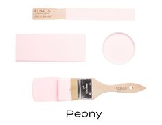 a pink paint brush with the words peony on it and two other brushes next to it