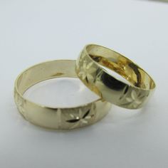 Purchase includes 2 wedding rings in 14k gold with diamond cut designs, and a 6mm width. For only $399 Ring sizes are adjustable, please note the sizes in the personalizing section of checkout. Gift box included. Engraved Diamond Cut Round Band Ring For Marriage, Diamond Cut Engraved Ring For Marriage, Engraved Diamond Cut Ring For Marriage, Adjustable Yellow Gold Couple Rings For Formal Occasions, 14k Gold Engraved Ring For Marriage, Yellow Gold Diamond Cut Bands For Marriage, Yellow Gold Diamond Cut Wedding Bands, Yellow Gold Engraved Ring For Marriage With Diamond Cut, Gold Bands With Diamond Cut For Marriage