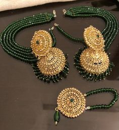 Get your attention on this eye candy for a perfect day and a perfect look! You deserve to look amazing with our beautiful champagne stones jhumka with emerald color beads sahara and mang tikka. Ore- order and will available in second week of December. Eid Reception Jewelry With Stone Work, Bollywood Style Cubic Zirconia Stone Work Jewelry, Dazzling Kundan Jewelry Sets, Hand Set, Bollywood Style Jewelry Sets For Eid, Round Stone Work Jewelry Sets For Party, Bollywood Style American Diamond Jewelry Sets For Party, Traditional Kundan Necklace With Cubic Zirconia For Party, Eid Party Jewelry Sets With Stone Work, Round Jewelry For Eid Party