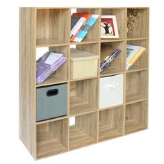 a book shelf with many books on top of it and some boxes in the middle