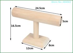 a wooden object is shown with measurements for the length and width on it's stand