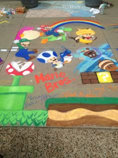 the sidewalk has been decorated with various cartoon characters