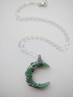 "This beautiful crescent moon shaped Green Aventurine stone is wrapped inside Sterling silver wire. Liver of sulphur has been used to give the silver an antique look, and it's sealed with Renaissance Wax to avoid tarnishing. The necklace has been made at 18\" on a Sterling silver chain, but length can be adjusted to fit your personal taste. The pendant hangs 1.5\" from chain. Finished with a lobster clasp. All my jewelry is handmade, and made with patience, care and love. In the unlikely event t Black Obsidian Ring, Green Aventurine Necklace, Green Aventurine Stone, Obsidian Ring, Aventurine Necklace, Raw Quartz Crystal, Aventurine Stone, Crescent Moon Necklace, Personal Taste