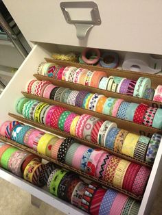 a drawer filled with lots of different types of washi tapes on top of each other