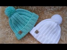 two knitted hats sitting next to each other