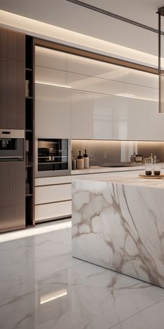 a kitchen with marble counter tops and white cabinets