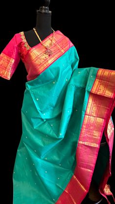 Pure Kanjvaram silk saree Vaira oosi kanchi pattu saree online usa  Gold zari lines throughout the body with hand embroidered blouse bridal kanchi pattu saree with Reddish pink pattu borders..  DETAILS AND CARE Color : Teal  silk withGold zari lines Weight : 600 - 800 grams Length : 5.5 m saree + 0.7 m blouse Width : 48 Inches Fabric : Pure Kanjivaram Pattu Plain Silk Craft Description : Kanjivaram, Kanjeevaram Wash Care : Dry Wash Only Shipping Time : 5 - 7 Working days We Ship Worldwide Comes with prestitched blouse size 36 goes up to 42 very beautiful high quality kanjivaram pure silk saree. SHIPPING AND RETURNS Shipping Policy : Shipping days as mentioned above, subject to changes based on the government regulations around the prevailing pandemic situation.  Return Policy : No returns Traditional Paithani Silk Lehenga With Tilla, Traditional Paithani Silk Lehenga With Tilla Details, Traditional Lehenga In Paithani Silk With Tilla, Traditional Tilla Detail Paithani Silk Lehenga, Traditional Tilla Lehenga In Paithani Silk, Green Tilla Saree For Puja, Diwali Paithani Silk Dupatta With Tilla, Festival Paithani Silk Lehenga With Tilla, Navratri Paithani Silk Saree With Tilla