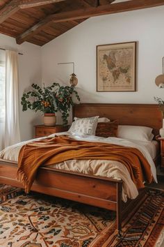 a bed sitting in a bedroom next to a window