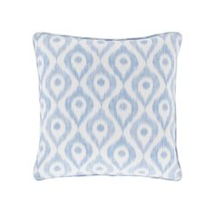 a blue and white pillow on a white background