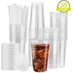 clear plastic cups with lids are stacked on top of each other, and one cup is full