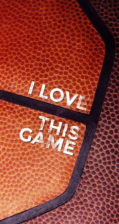 the words i love this game written on an orange basketball