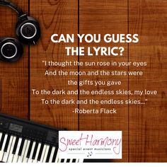 a keyboard and headphones sitting on top of a wooden table next to a note with the words can you guess the lyric?