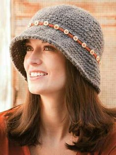 a woman wearing a knitted hat and smiling