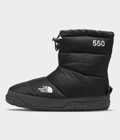 The Women’s Nuptse Après Booties are a casual take on our iconic expedition footwear. These durable, water-repellent booties feature recycled ripstop uppers and warm 550-fill down insulation. A simple toggle closure makes this cold-weather staple easy to put on and easy to love. Women's Women's Slippers. Water-repellent. [North Face, Northface, thenorthface, the northface, TNF, tnf] North Face Nuptse, Snowboarding Women, Complete Skateboards, Snowboard Boots, Easy To Love, North Face Mens, Workout Accessories, North Face Women, Sunglasses Branding