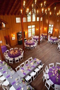 an overhead view of a banquet hall with purple and white tables