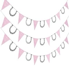 a pink bunting banner with umbrellas hanging from it