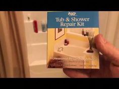 a person holding up a bathtub and shower repair kit