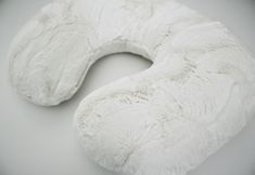 a large white pillow sitting on top of a table