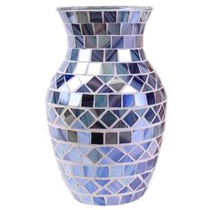 a blue and white mosaic vase on a white background