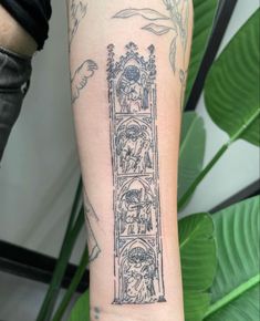 a tattoo on the arm of a woman with a clock and angels above her head