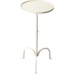 a white table with a metal stand on it