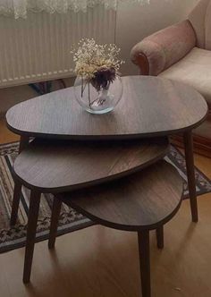 three wooden tables sitting on top of a hard wood floor