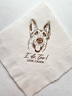 a napkin with a dog's face on it and the words i do too love casen