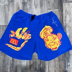 Mens Cactus Jack/Travis Scott X Mcdonald’s Shorts In Size Medium Travis Scott X Mcdonald's Illustration Shorts Blue Worn A Handful Of Times. Amazing !! Selling For $380 On Goat But For Brand New Ships Next Day. Blue Swim Trunks For Summer Streetwear, Blue Graphic Print Beach Bottoms, Blue Graphic Print Bottoms For Summer, Blue Casual Shorts With Graphic Print, Casual Blue Shorts With Graphic Print, Blue Graphic Print Shorts, Casual Blue Graphic Print Shorts, Travis Scott Blue, Cactus Jack Travis Scott