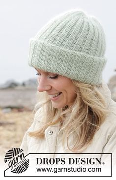 a woman wearing a green knitted hat