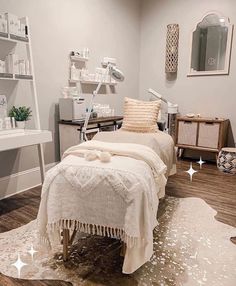 a bed room with a neatly made bed next to a shelf filled with bottles and other items