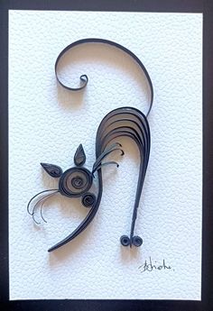 an artistic paper sculpture of a cat on a white background with black frame and border