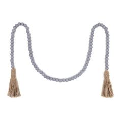 a necklace with grey beads and tassels