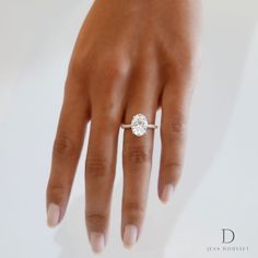 a woman's hand with a diamond ring on it, and the caption below