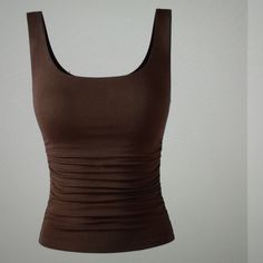 A Longer Version Of Our Best Selling Sides Square Brami Tank Top. Square Neckline. Flattering Cinched Sides. Removable Bra Padding Included. Sleeveless. Double Lined, Non See Through. Easy-To-Wear Wardrobe Staple. 66%Viscose, 28% Nylon, And 6% Spandex Fitted Brown Top With Built-in Bra, Fitted Brown Tops With Built-in Bra, Brown Fitted Top With Built-in Bra, Fitted Brown Workout Tops, Brown Sleeveless Workout Top, Chocolate Color, Padded Bras, Square Necklines, Square Neckline