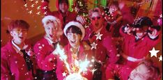 a group of people dressed in red and white posing for a photo with stars on them