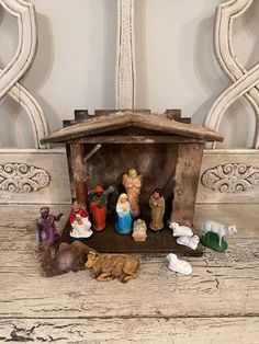 a small nativity scene with figurines and other items