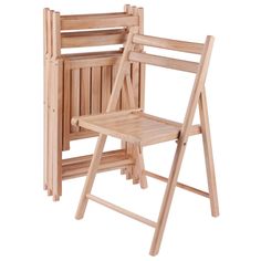 two wooden folding chairs sitting next to each other