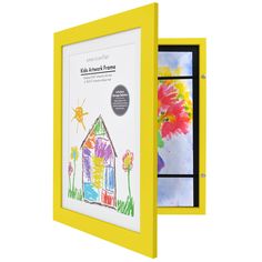 a child's artwork is displayed in a yellow frame with an open window to the outside