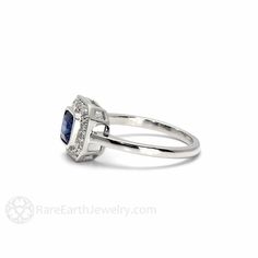 A gorgeous Art Deco inspired Blue Sapphire ring with diamonds. At the center is a 1.0ct asscher cut natural Blue Sapphire and there are .15ct of conflict free diamonds in the halo. This ring is available in 14K or 18K White, Yellow or Rose Gold. Gorgeous! For more beautiful Blue Sapphire jewelry, click here: http://www.etsy.com/shop/RareEarth/search?search_query=blue+sapphire Official Website: www.RareEarthJewelry.com SCHEDULE This ring is made to order and will take approximately 3 to 4 weeks t Asscher Cut Sapphire Diamond Ring In Fine Jewelry Style, Asscher Cut Halo Ring For Promise, Timeless Asscher Cut Sapphire Ring, Sapphire Asscher Cut Ring With Halo Setting, Sapphire Rings With Halo Setting In Asscher Cut, Sapphire Rings With Halo Setting And Asscher Cut, 14k White Gold Asscher Cut Sapphire Ring, Asscher Cut Sapphire Ring In 14k White Gold, Timeless Asscher Cut Sapphire Ring With Diamond