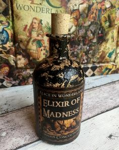 an old bottle sitting on top of a wooden table