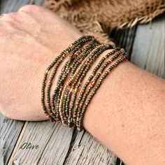 Olive Wrap Bracelet or Necklace on Stretch Cord - Etsy Beaded Bronze Copper Bracelets, Bronze Beaded Copper Bracelets, Adjustable Beaded Copper Bracelets, Bohemian Gold Beaded Copper Bracelets, Wrap Bracelet, Beaded Bracelets, Bracelet