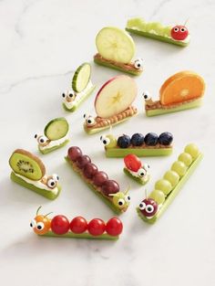 many different fruits and vegetables are arranged in the shape of caterpillars with eyes on them