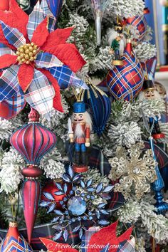 a christmas tree decorated with red, white and blue ornaments