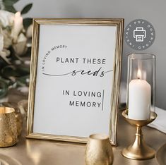 there is a sign that says plant these seeds in loving memory next to some candles