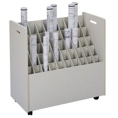 an office desk organizer with several compartments and dividers on the bottom, in white