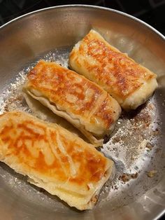 some food is cooking in a pan on the stove top and it looks like they have been cooked