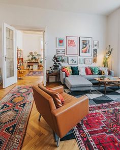 a living room filled with furniture and rugs