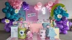 a birthday party with balloons and decorations